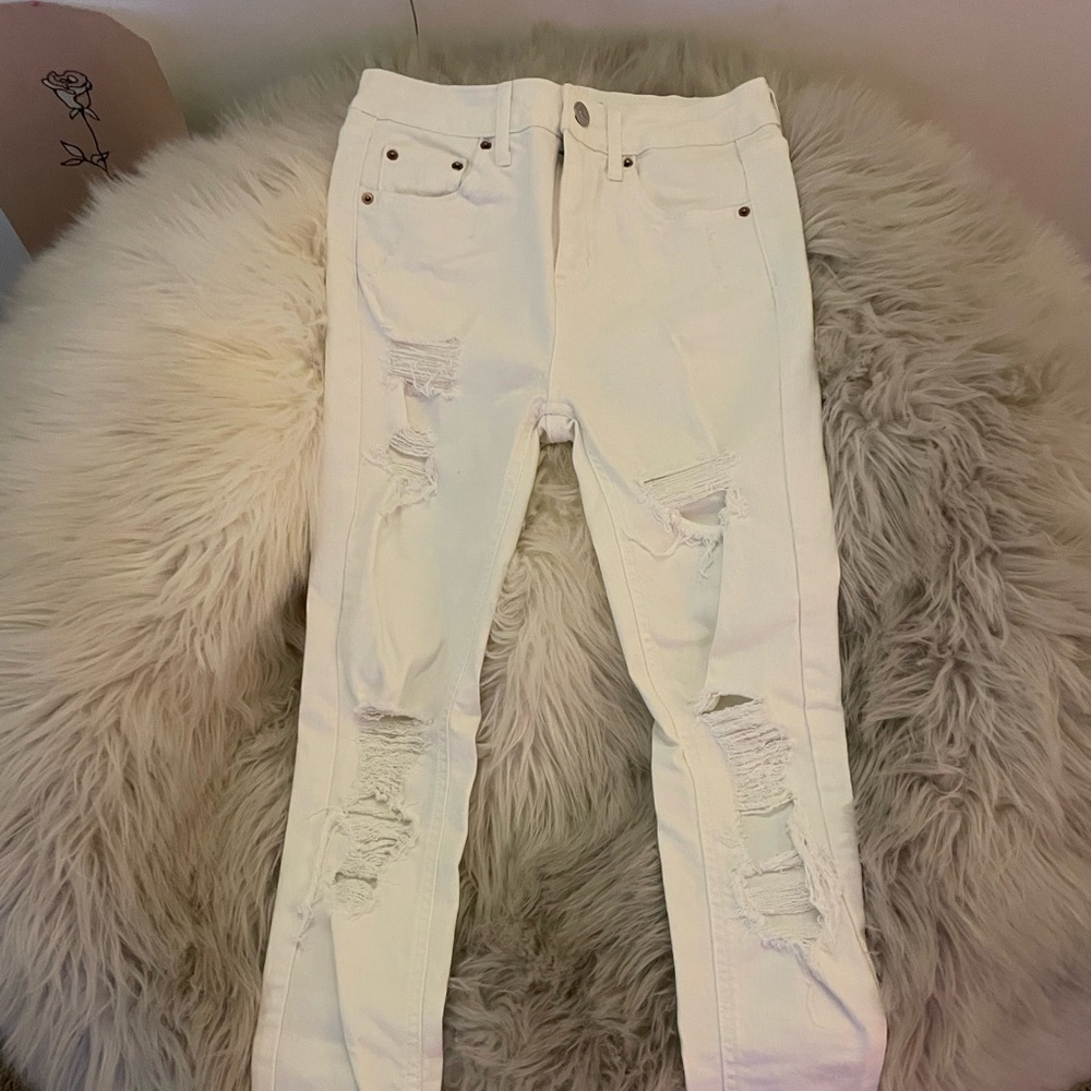 Tight ripped white jeans